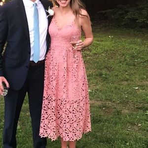 Gently used pink midi dress by ASTR the Label in a size Medium